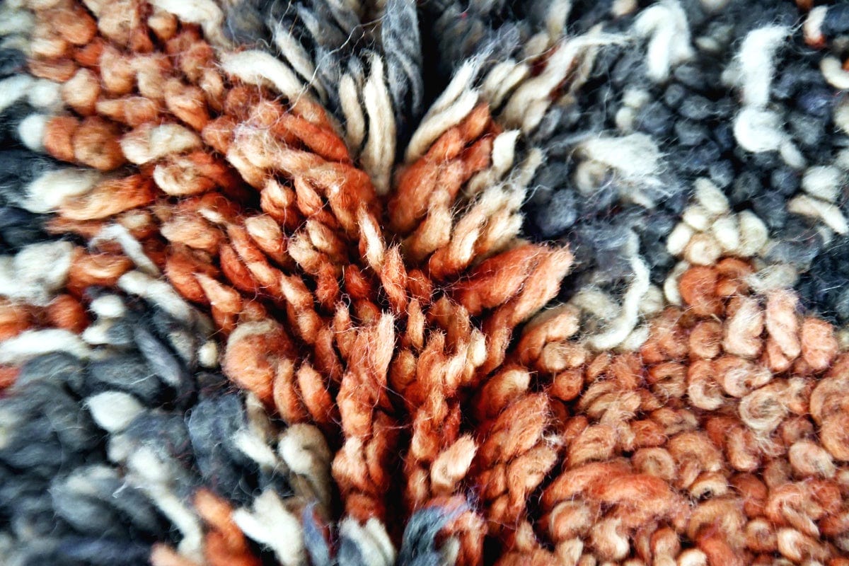 Rust blue vintage bujaad rug symethrical close up