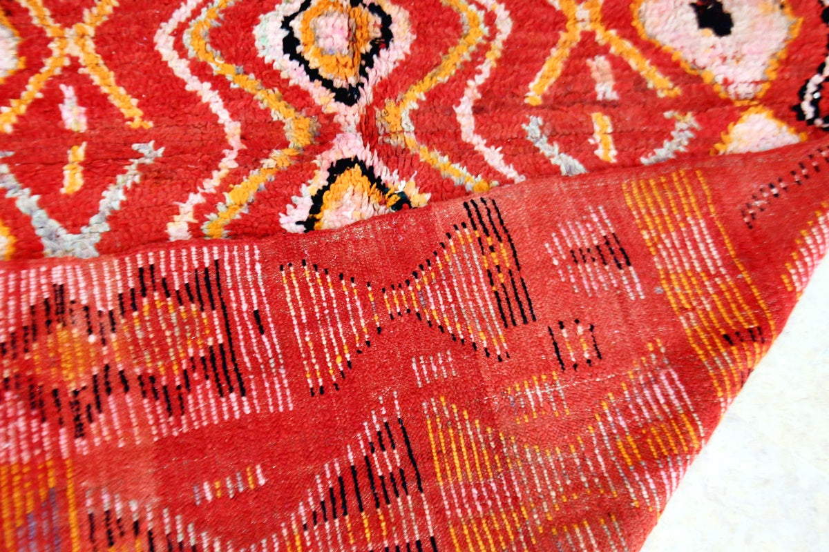 Red Boujaad moroccan vintage rug back folded