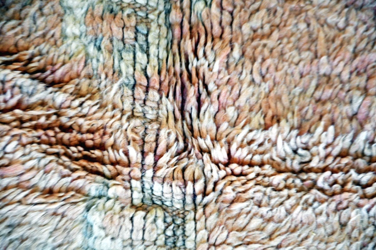 Faded peach blush boujaad vintage rug morocco close up