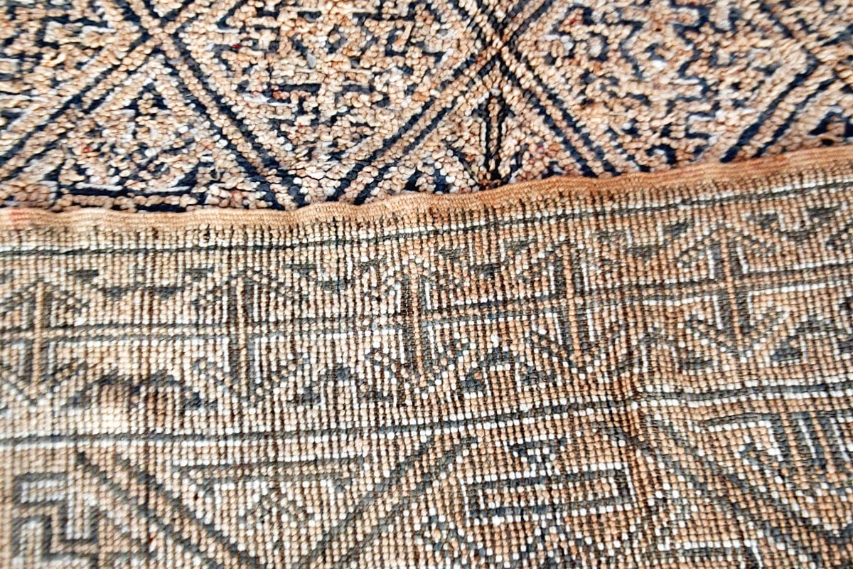 Folded beige grey beni mguild vintage rug