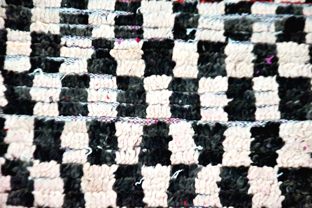 Moroccan vintage checker runner wool rug close up