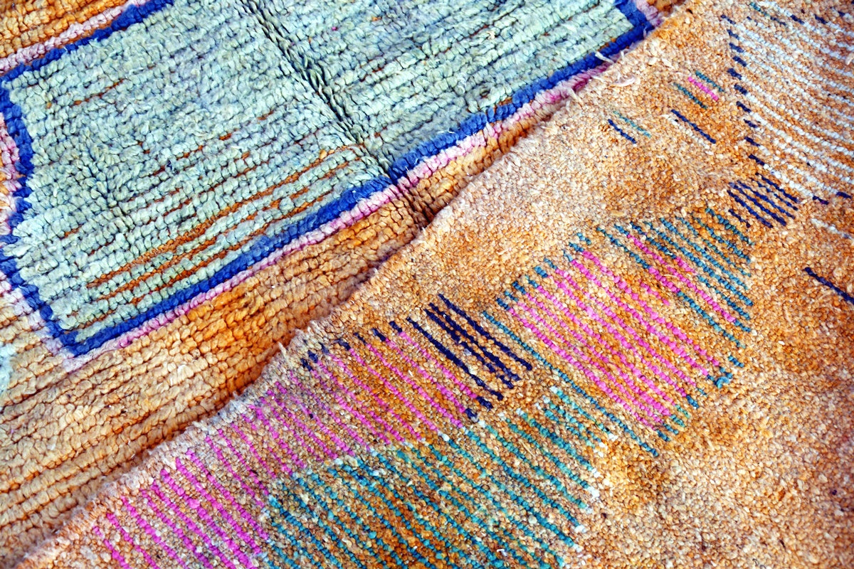 Orange blue abstract moroccan area rug back