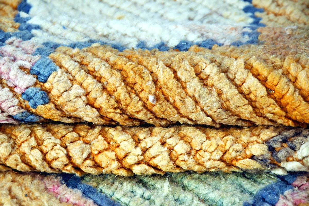 Orange blue abstract moroccan area rug side folded