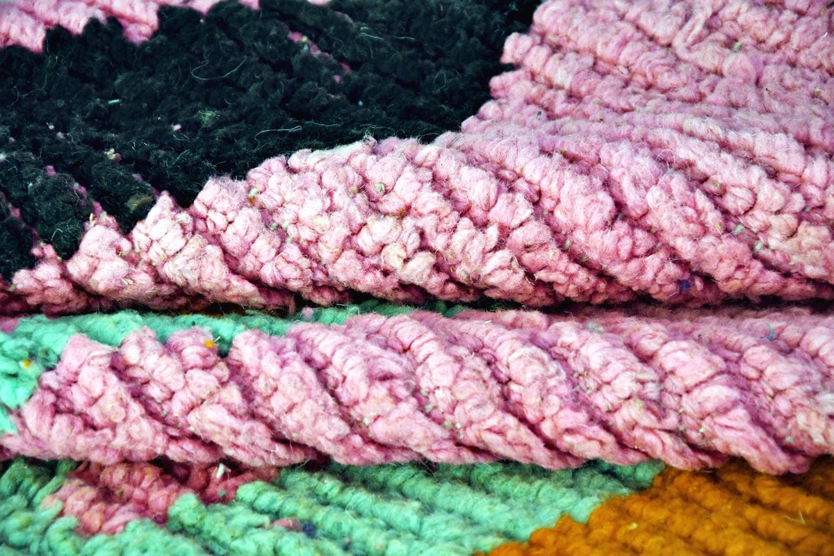 Pink black diamond Moroccan boujaad rug folded