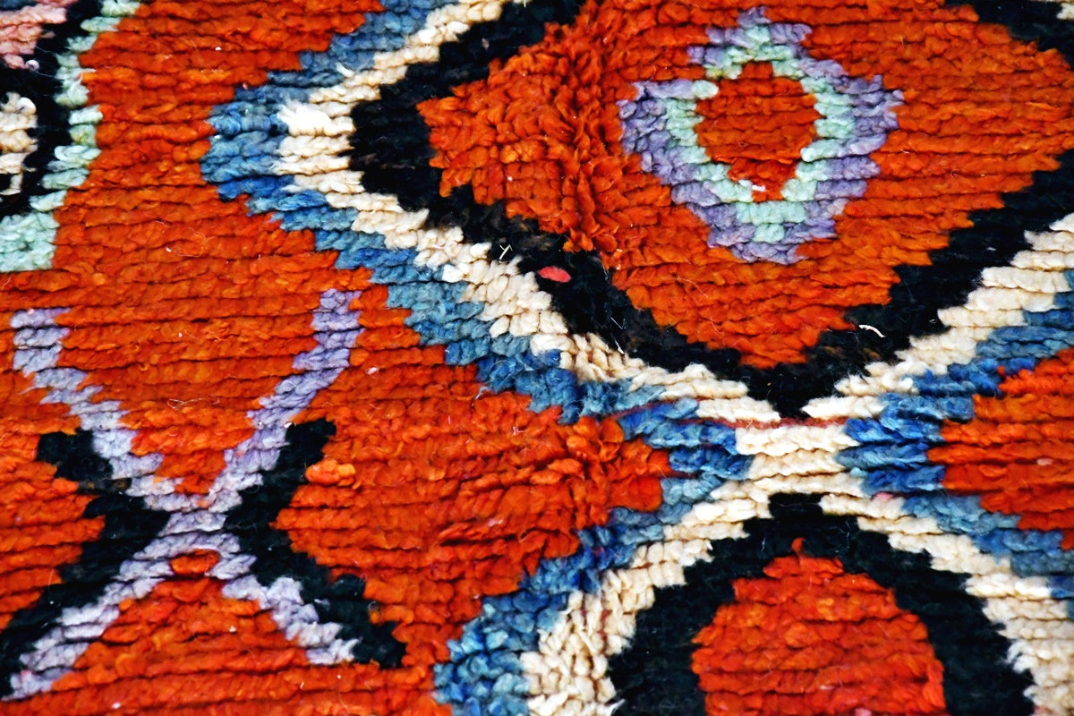 Red white black moroccan boujaad rug close up
