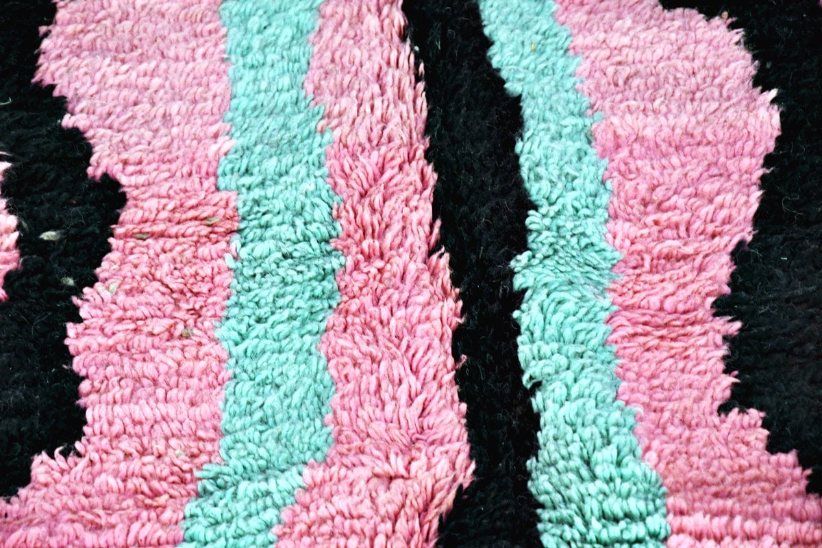 Pink green black abstract moroccan boujaad rug close up