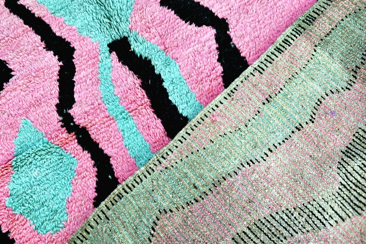 Pink green black abstract moroccan boujaad rug folded