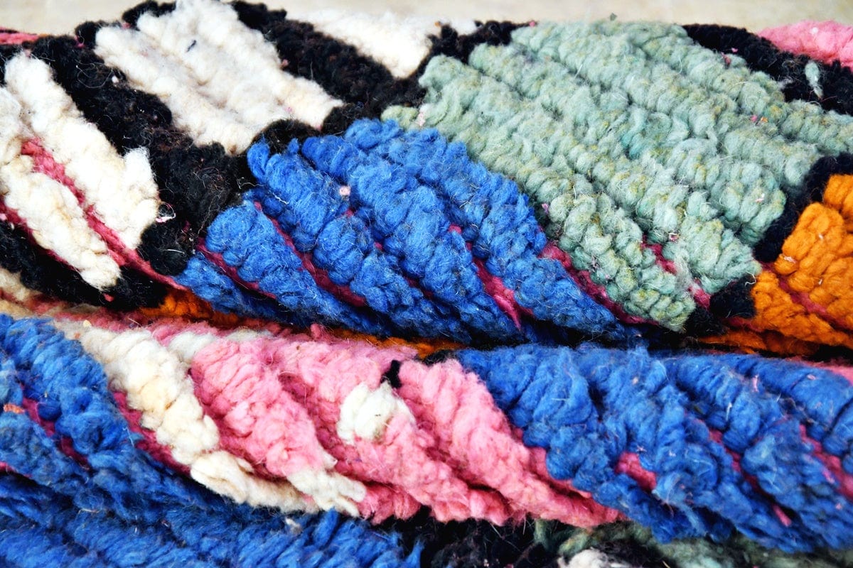 Pink blue abstract moroccan boujaad rug folded