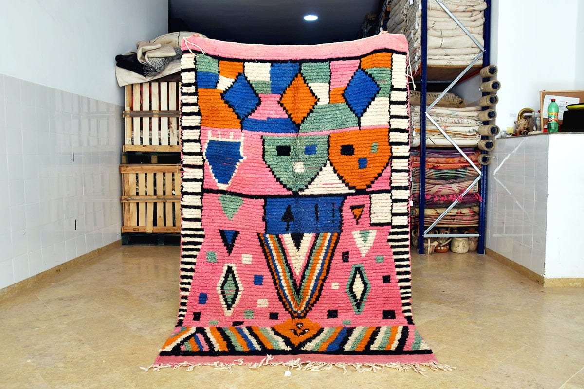Pink abstract moroccan boujaad rug standing