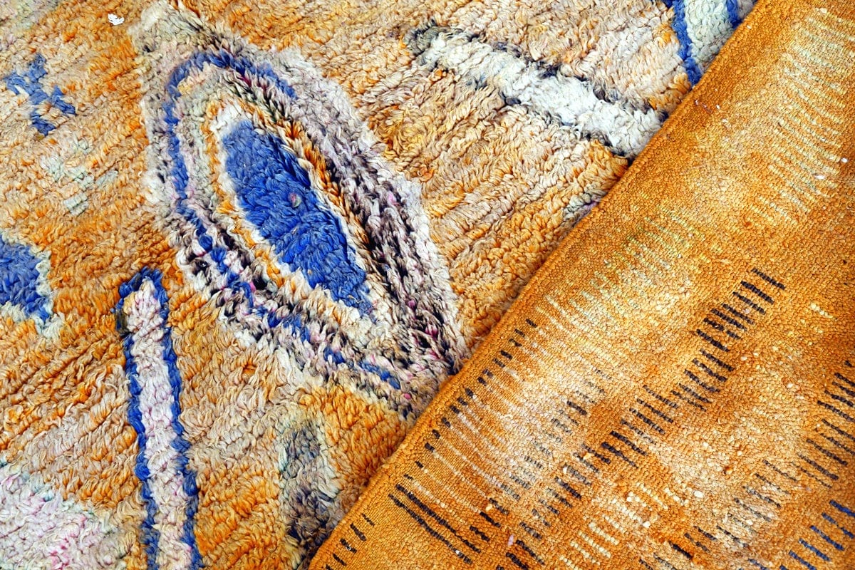 Boujaad moroccan rug close up orange and blue diamonds fertility