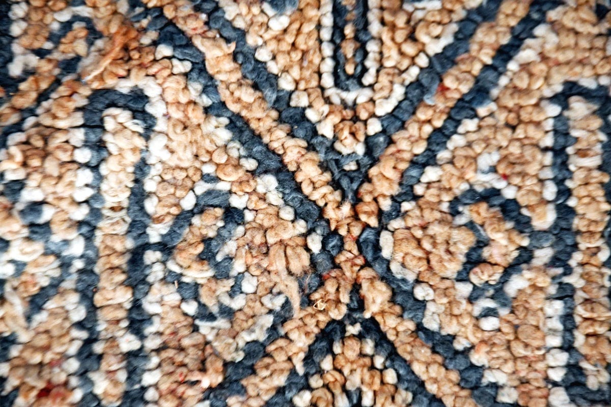 close up beige grey beni mguild vintage rug