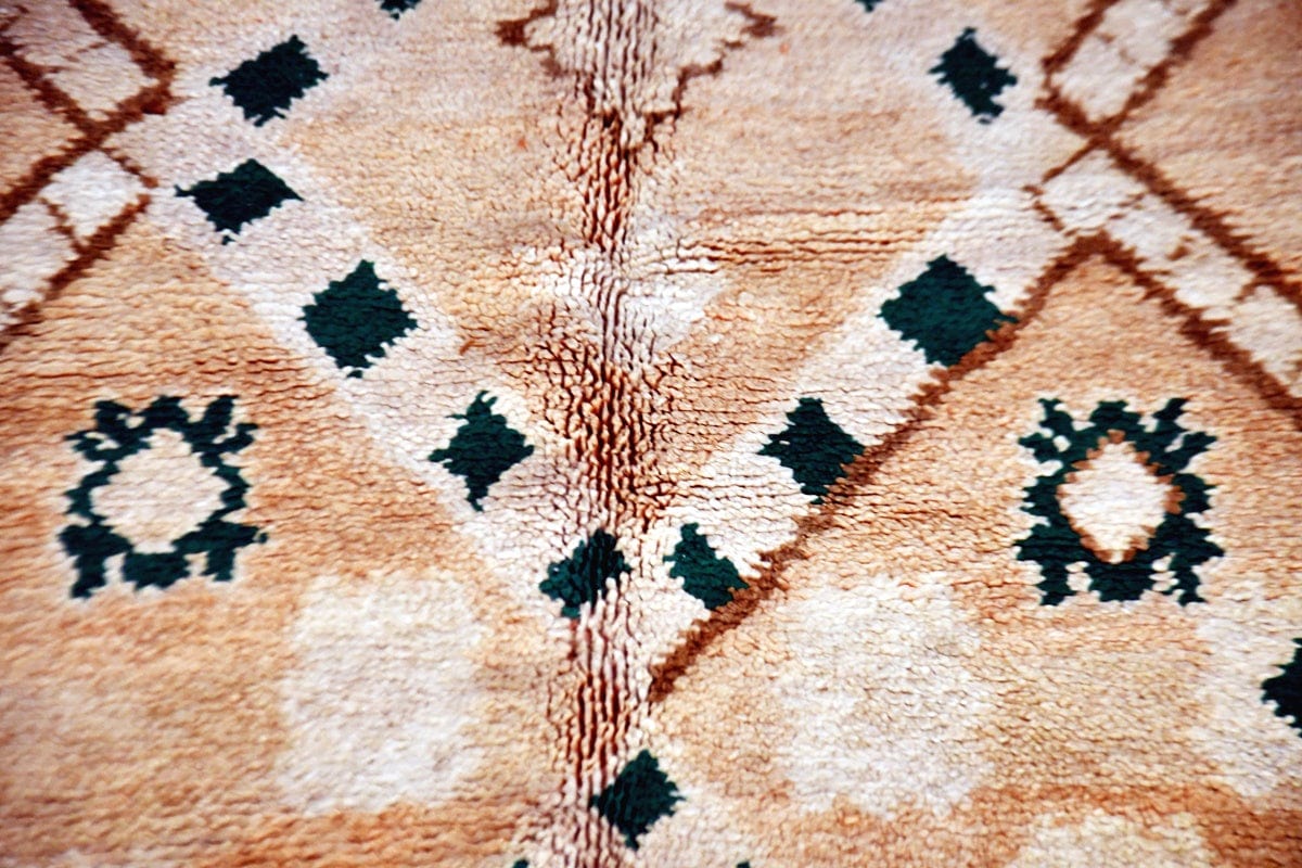close up earthy Moroccan zemmour vintage rug
