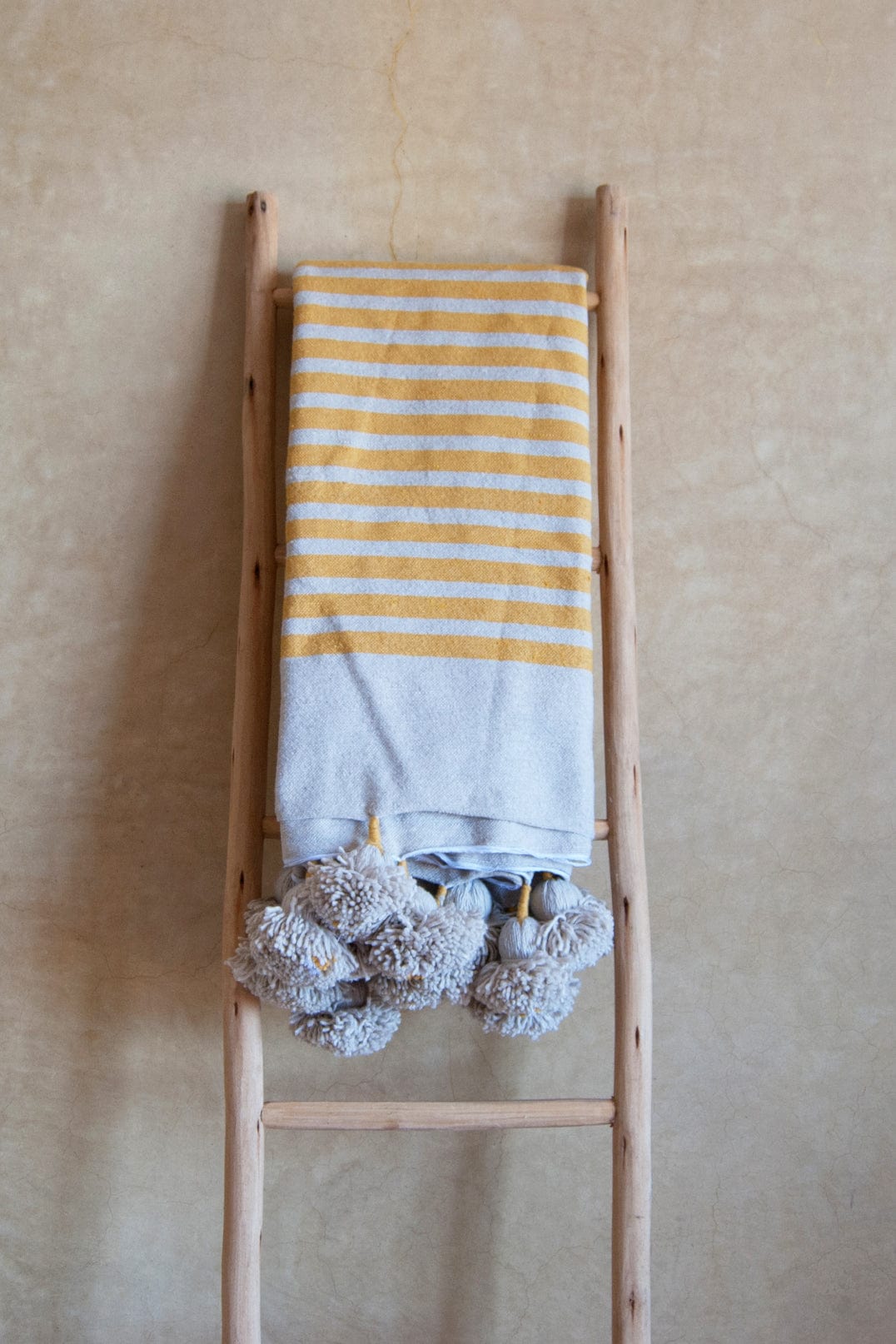 STONE_MUSTARD_POM_POM_BEDSPREAD