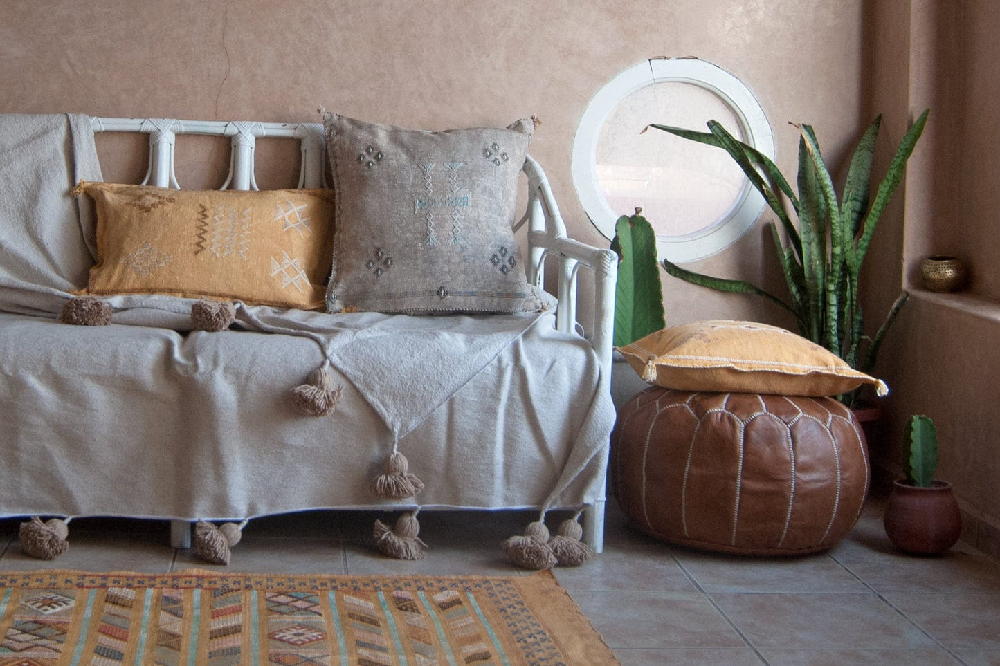 Tan ather circle pouf round ottoman