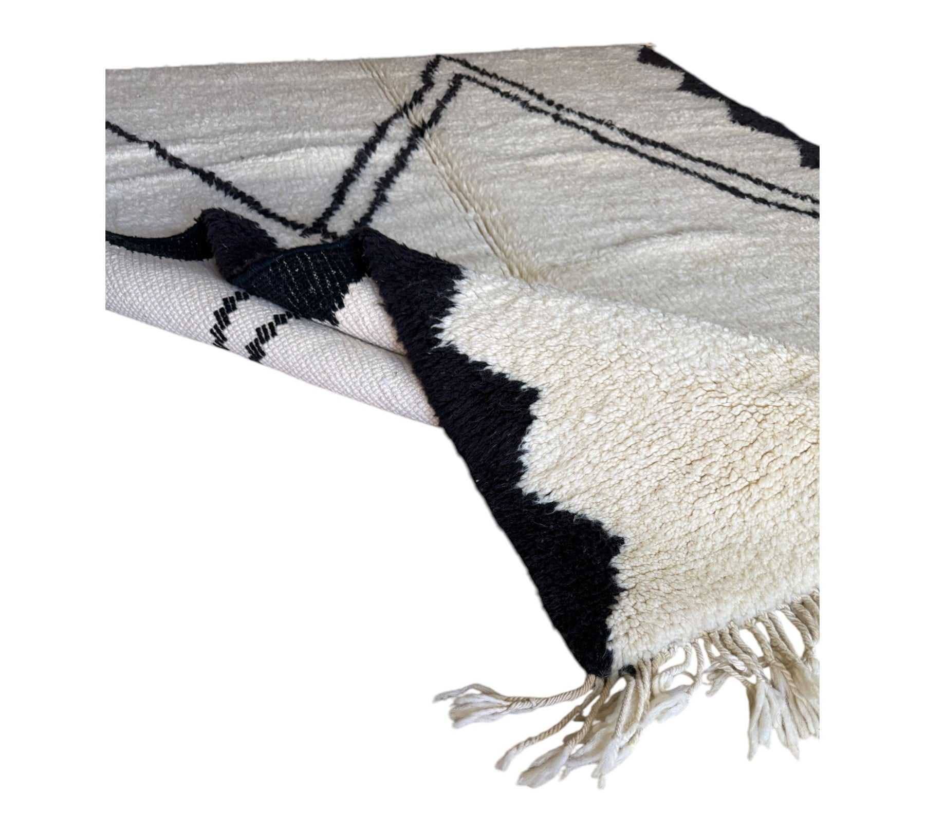 Black and white Beni Ourain rug folded