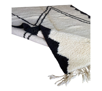 Black and white Beni Ourain rug folded