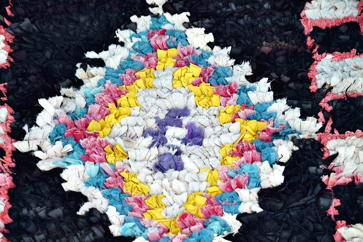 Black blue pink vintage boucherouite rug close