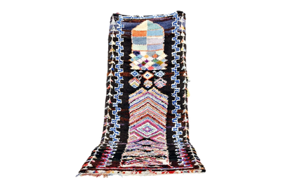 Boho black blue moroccan boucheoruite industrial wool rug standing