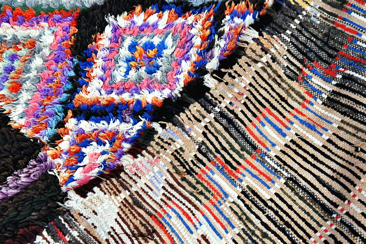 Boucherouite black blue rug close up folded