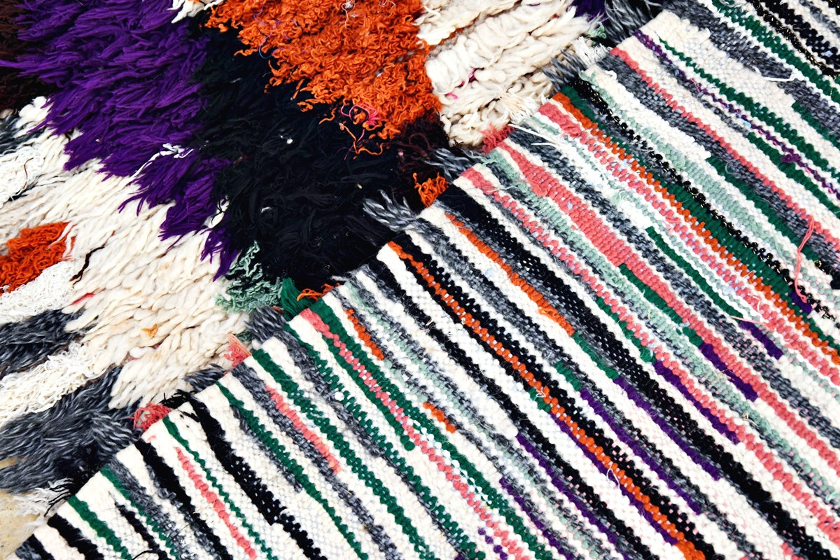 Boucherouite black pink rug close up folded