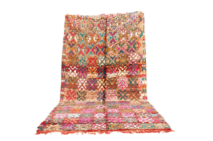 Bright red pink green vintage moroccan zemmour rug standing