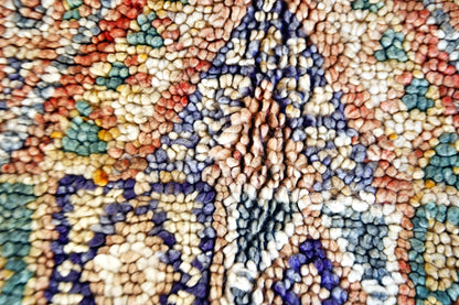 Close up faded rust green beni mguild rug