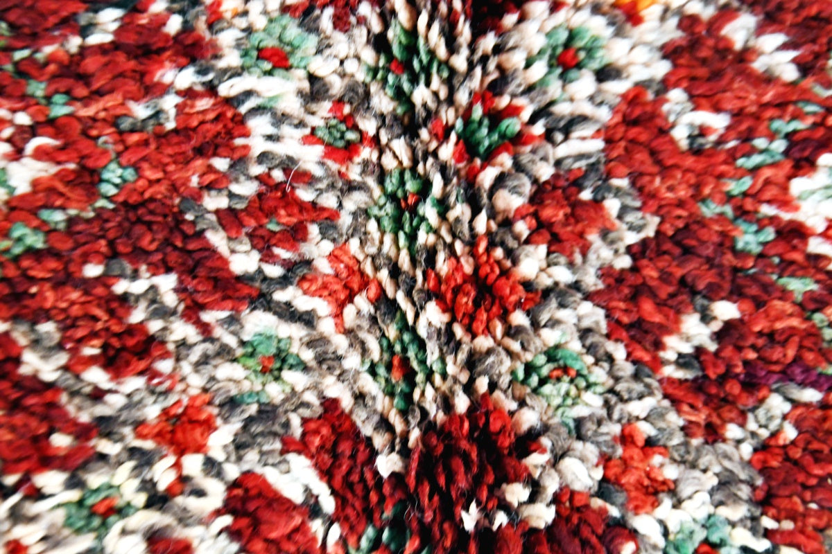 Folded Beni Mguild vintage collector rug close