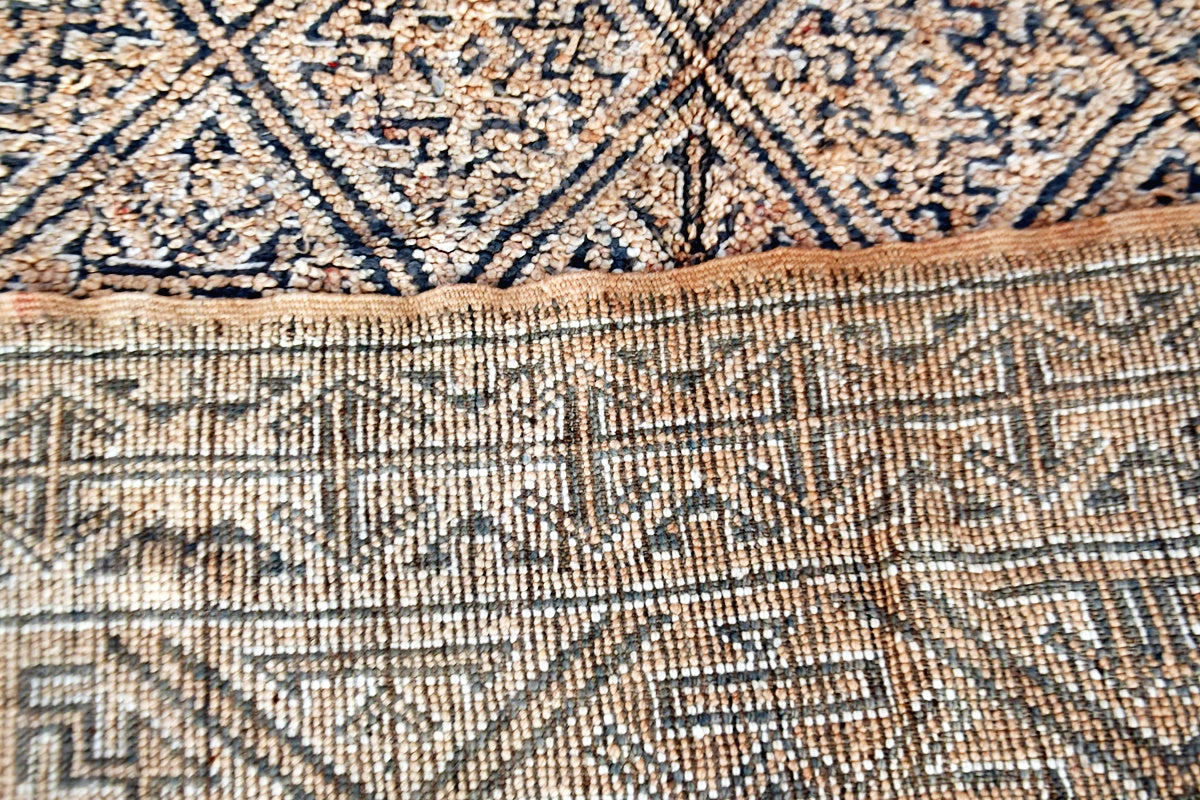 Folded beige grey beni mguild vintage rug