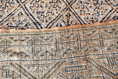 Folded beige grey beni mguild vintage rug