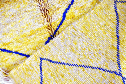 Moroccan beni mrirt yellow blue rug