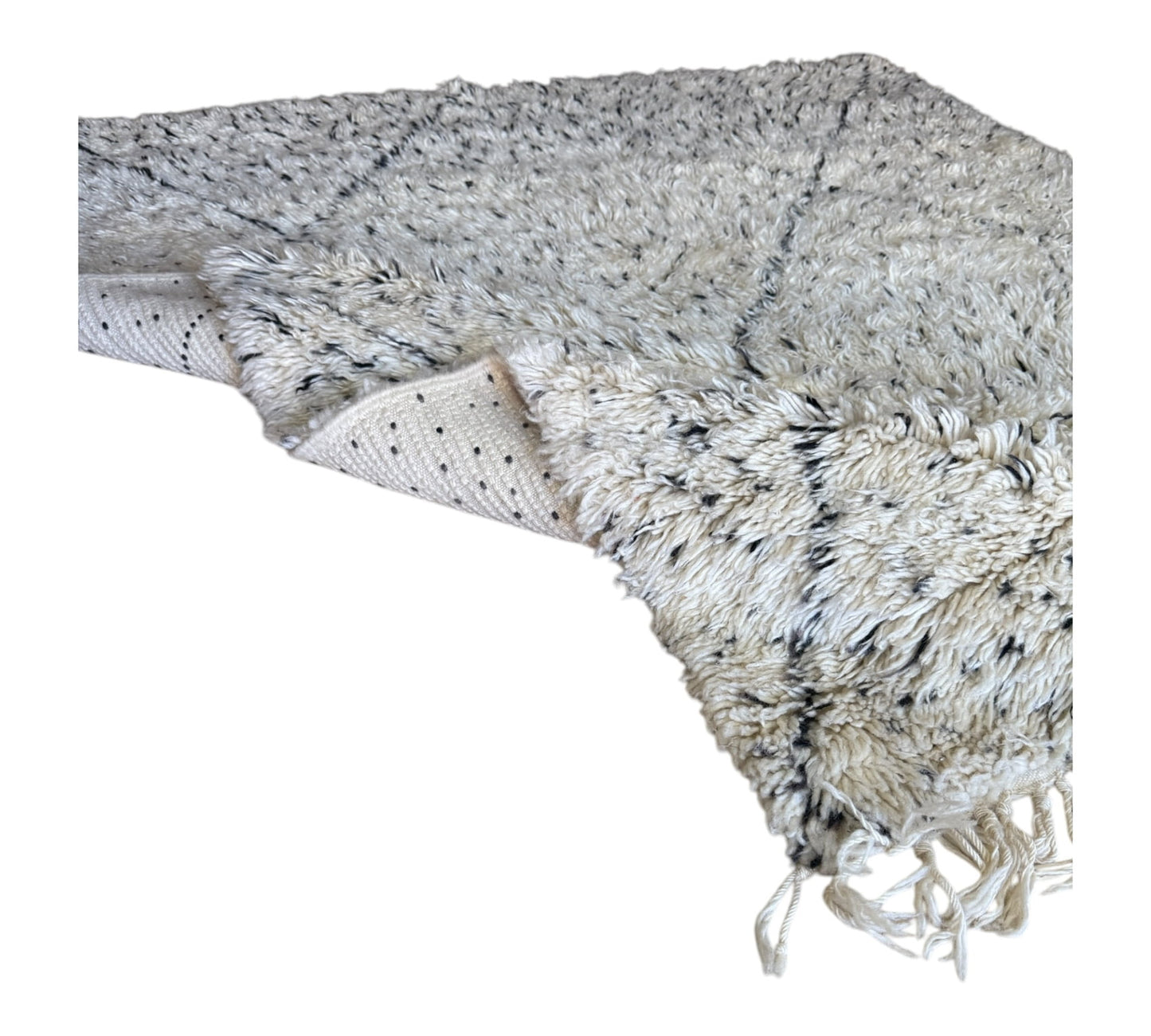 Polka dots beni ourain rug closeup plush folded