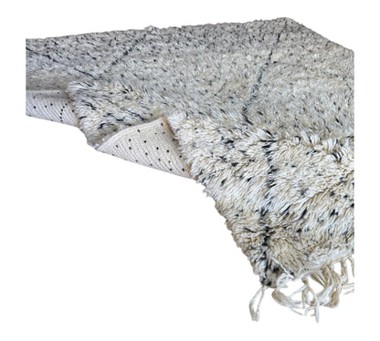 Polka dots beni ourain rug closeup plush folded
