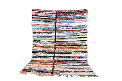Striped Moroccan Boucherouite rug blue red white black standing