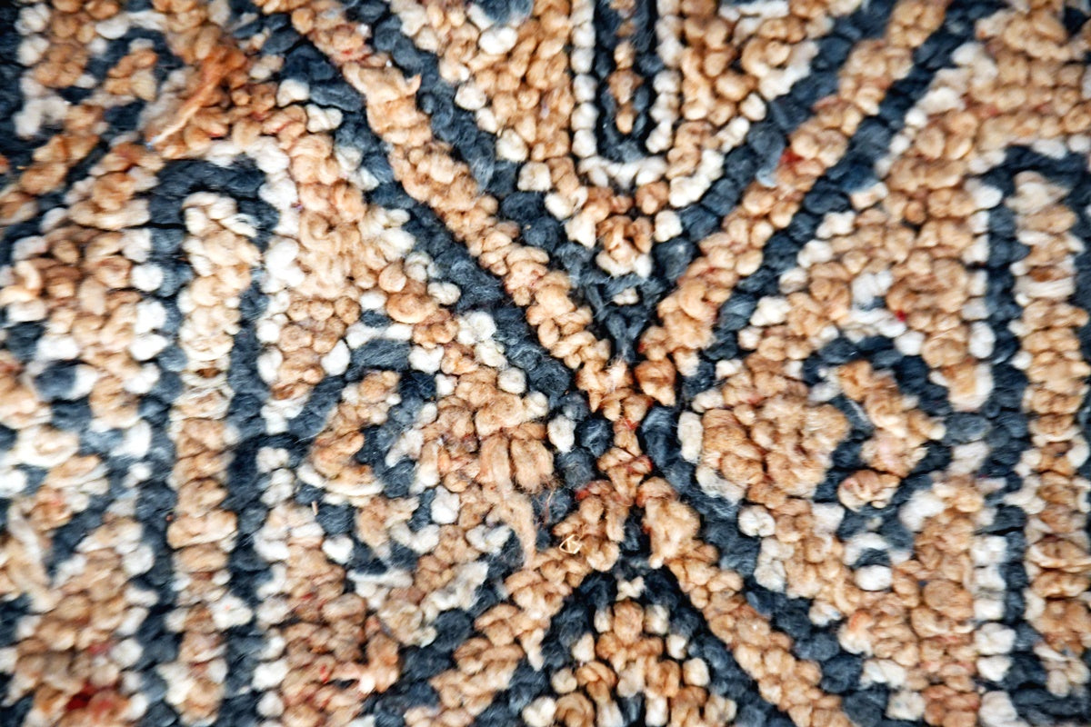 close up beige grey beni mguild vintage rug