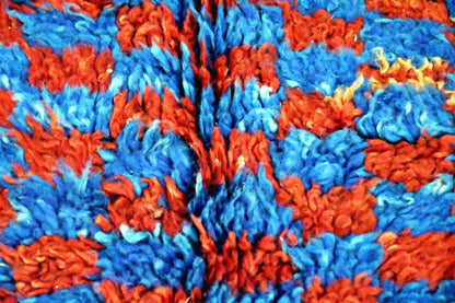 close up beni mguild checker rug blue indigo red