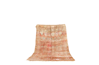 faded red symethrical moroccan vintage zemmour rugs standing