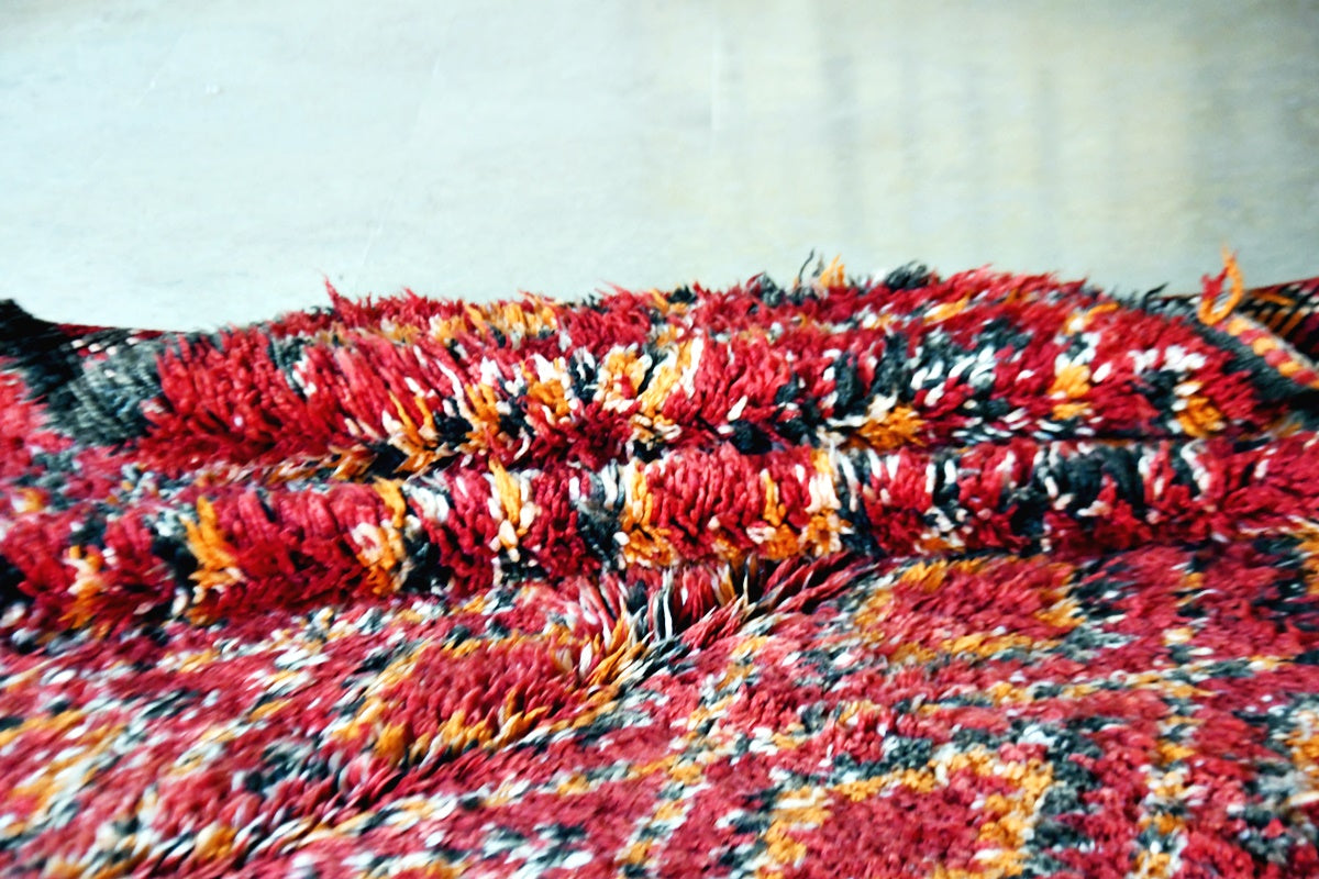 folded red beni mguild rug vintage 