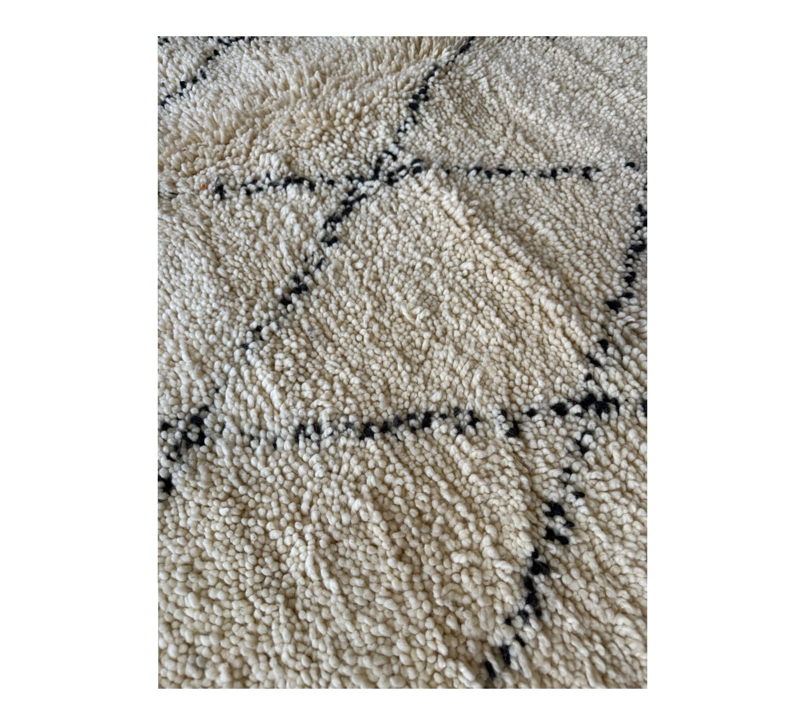 white & black diamonds symethrical beni ourain moroccan rug close up