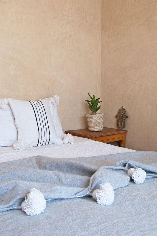 grey white pompoms bedspread lifestyle